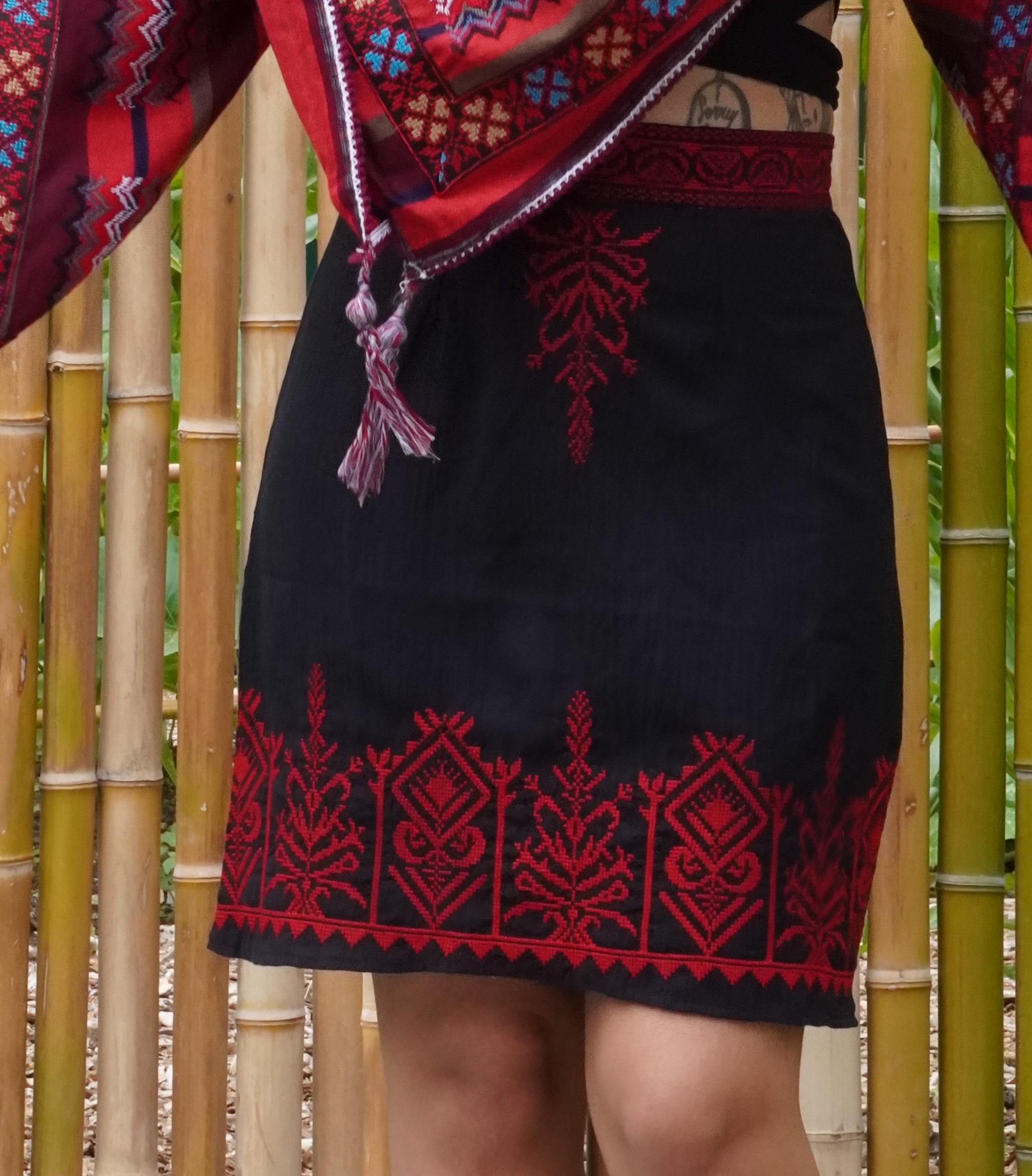 Short black skirt with red embroidery