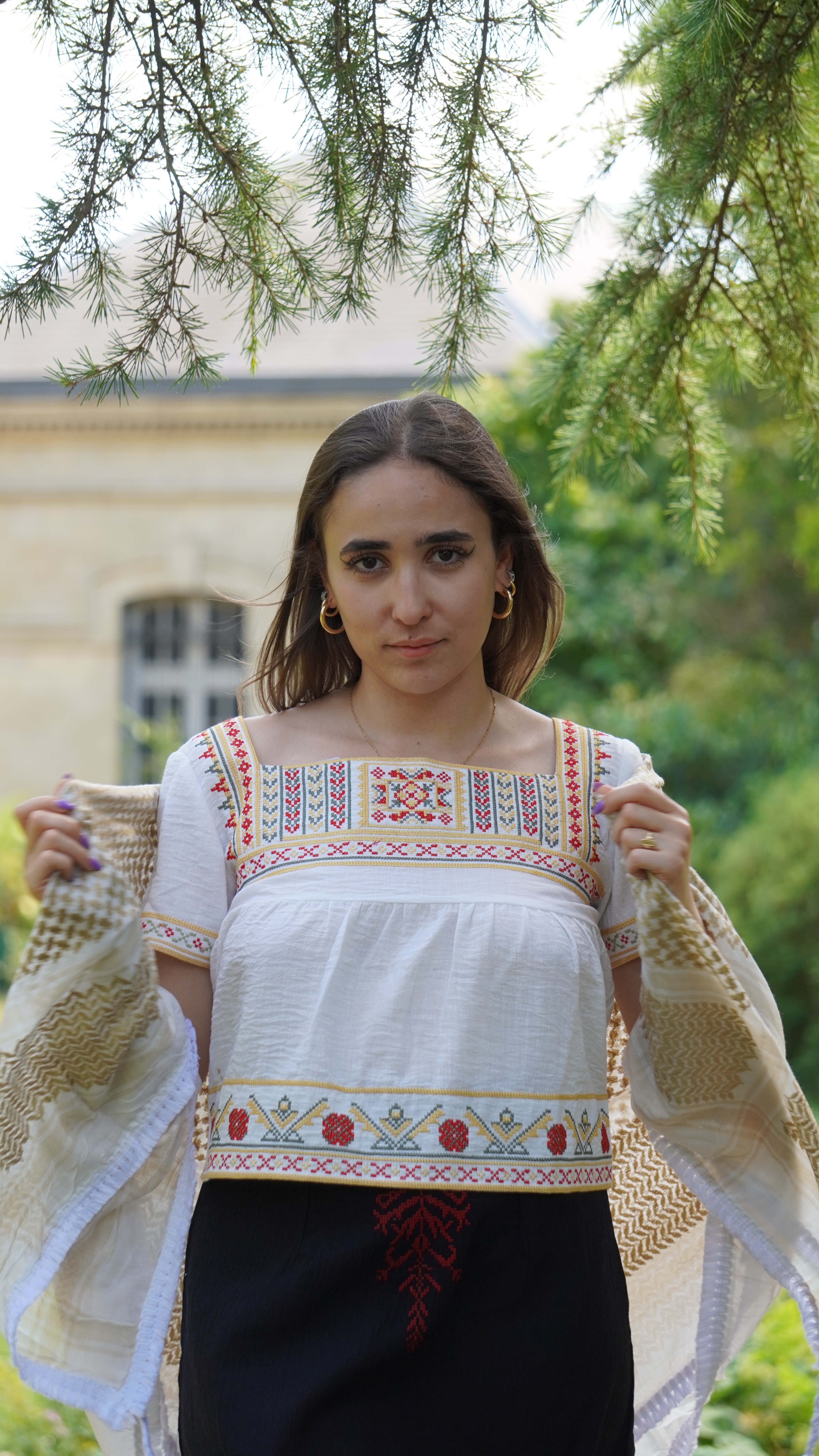 Short white blouse with red, yellow and grey embroidery