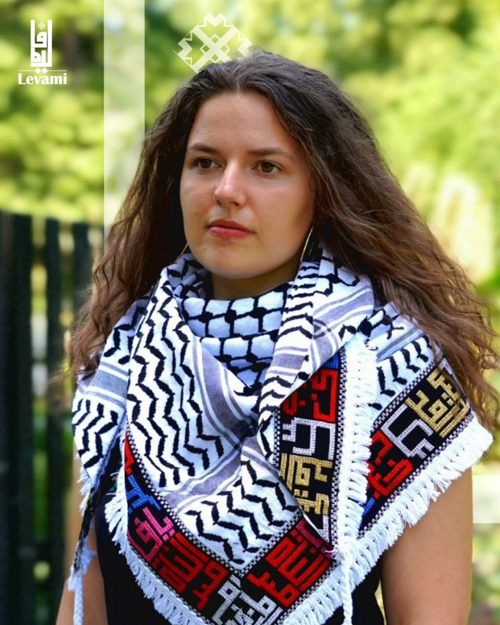 Embroidered black and white keffieh — Palestinian cities in Arabic
